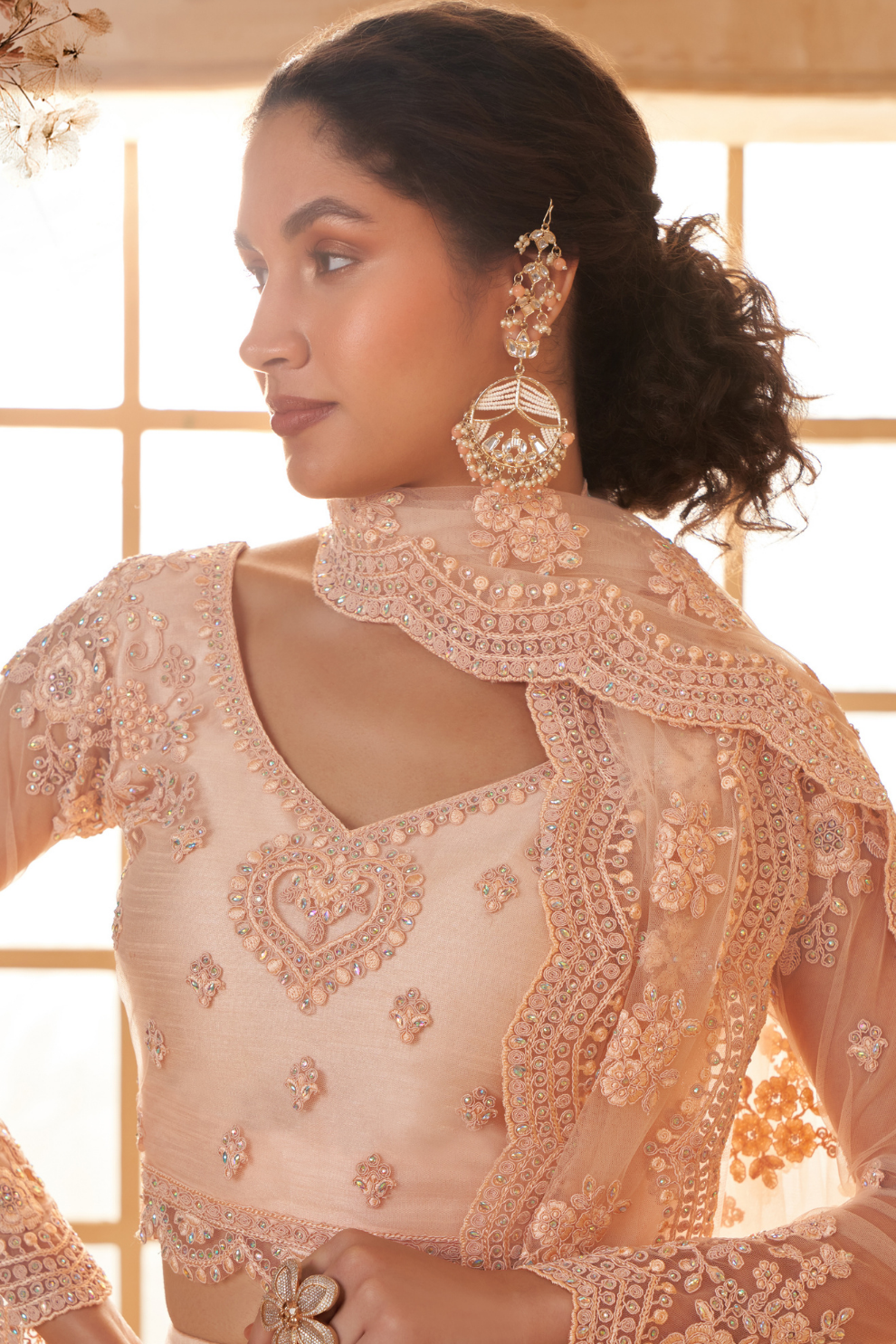Peach Designer Net Lehenga Choli With Intricate Embroidery