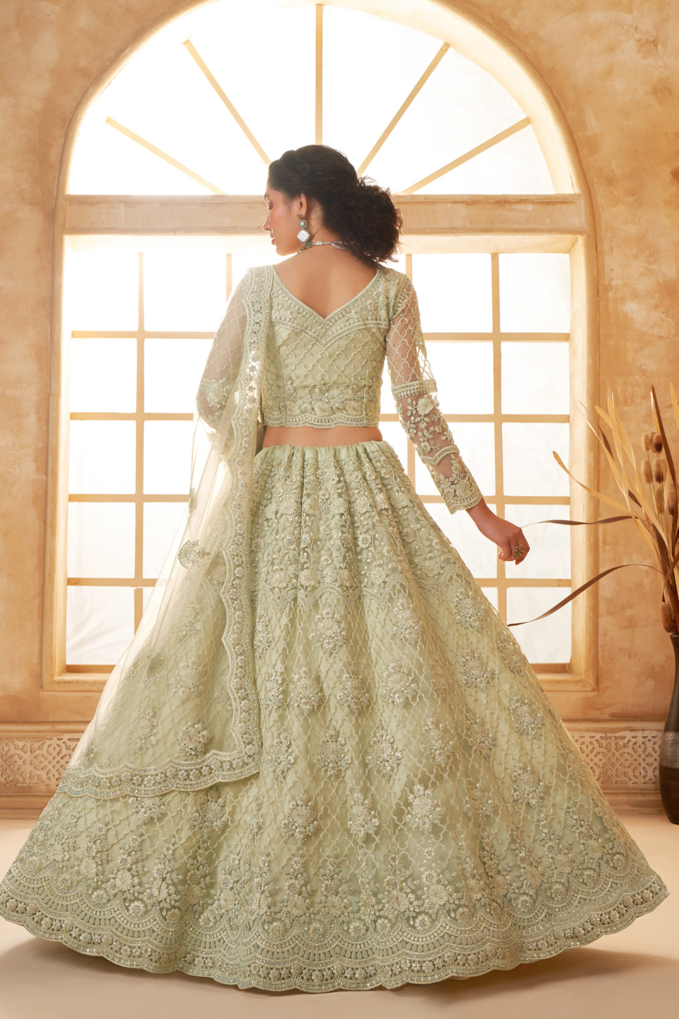 Elegant Pista Green Net Lehenga Choli With Rich Embroidery