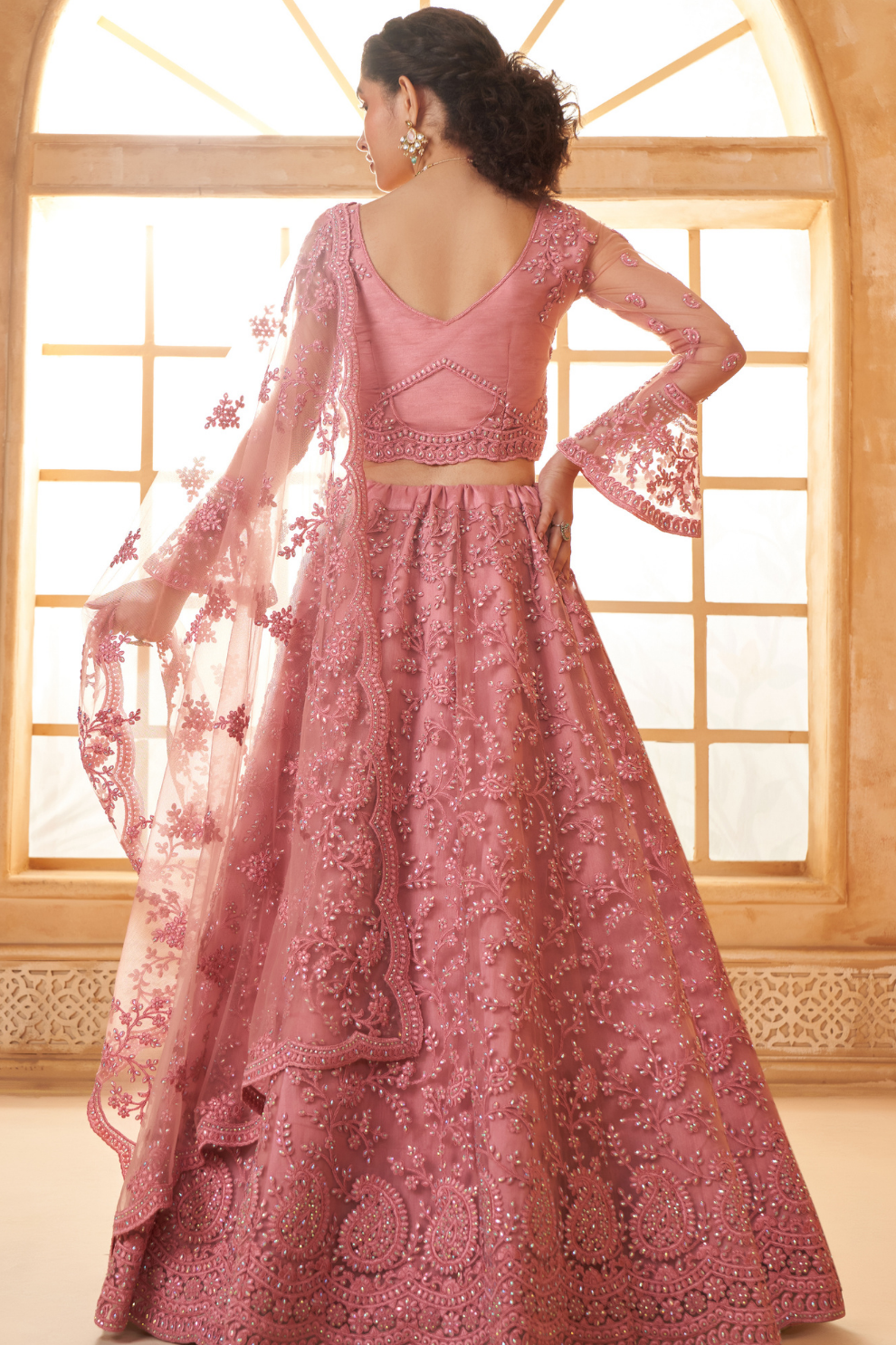 Graceful Pink Net Lehenga Choli With Intricate Thread Embroidery