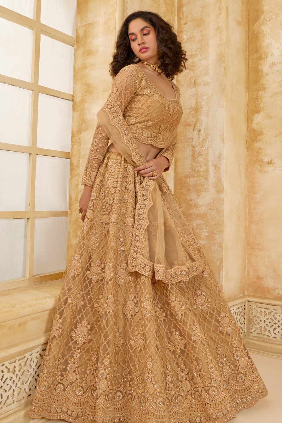 Golden Heavy Embroidered Net Lehenga Choli With Dupatta