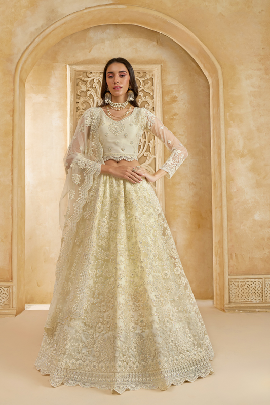 Soft Cream Net Lehenga Choli With Opulent Bridal Embroidery