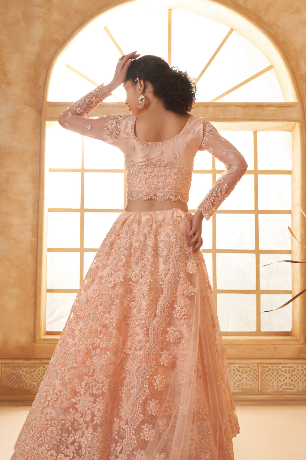 Peach Designer Net Lehenga Choli With Intricate Embroidery