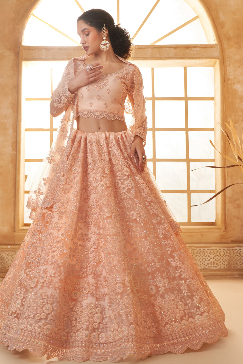 Peach Designer Net Lehenga Choli With Intricate Embroidery