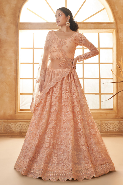 Peach Designer Net Lehenga Choli With Intricate Embroidery