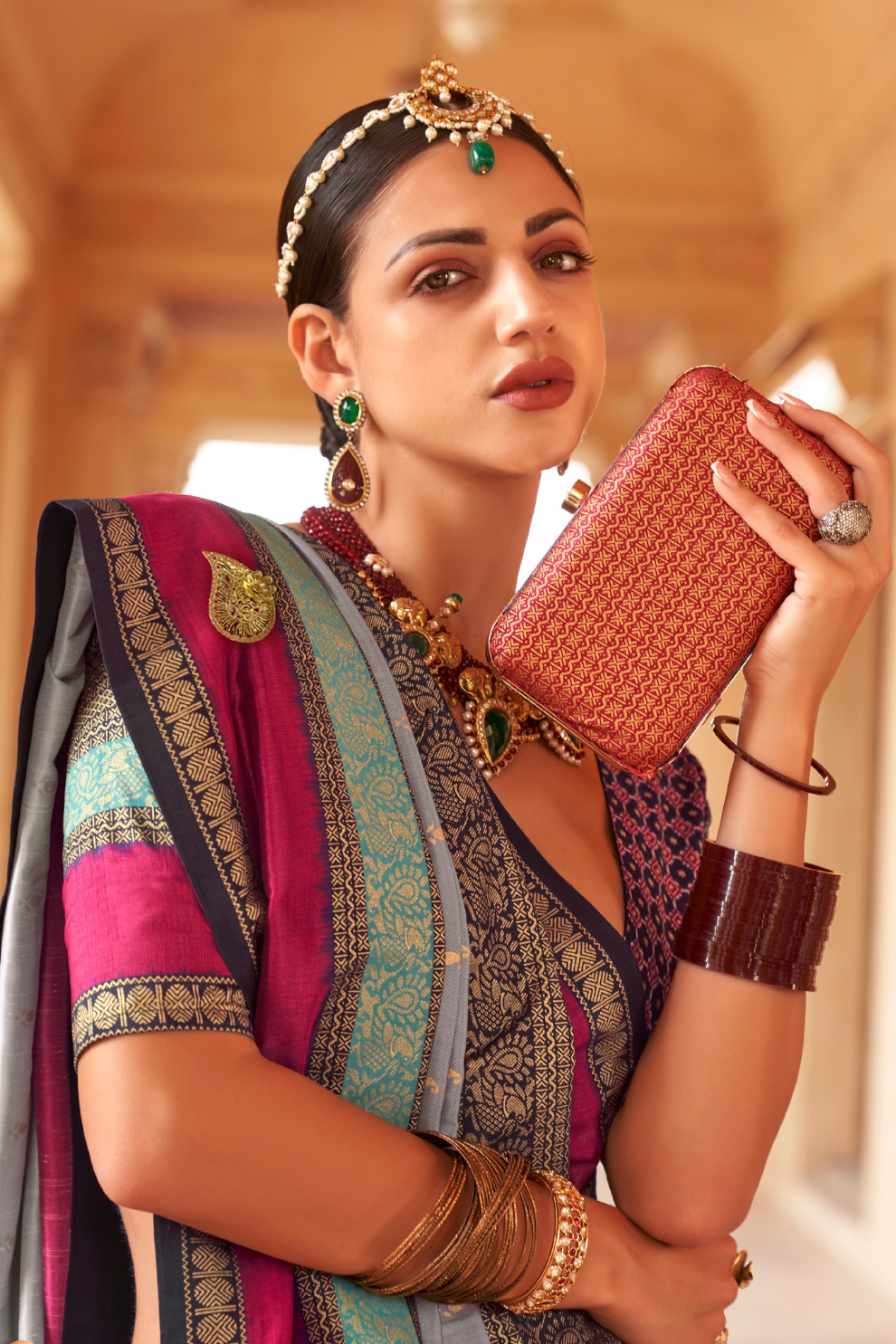Kanjivaram Style Silk Saree with Designer Brooch and Clutch