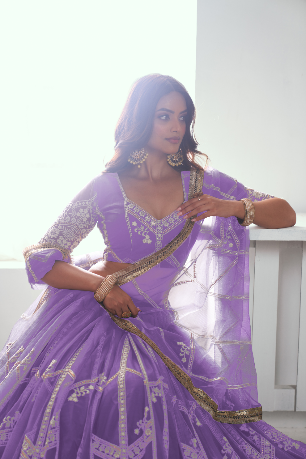 Graceful Net Lehenga Choli with Intricate Embroidery for Engagement Wear