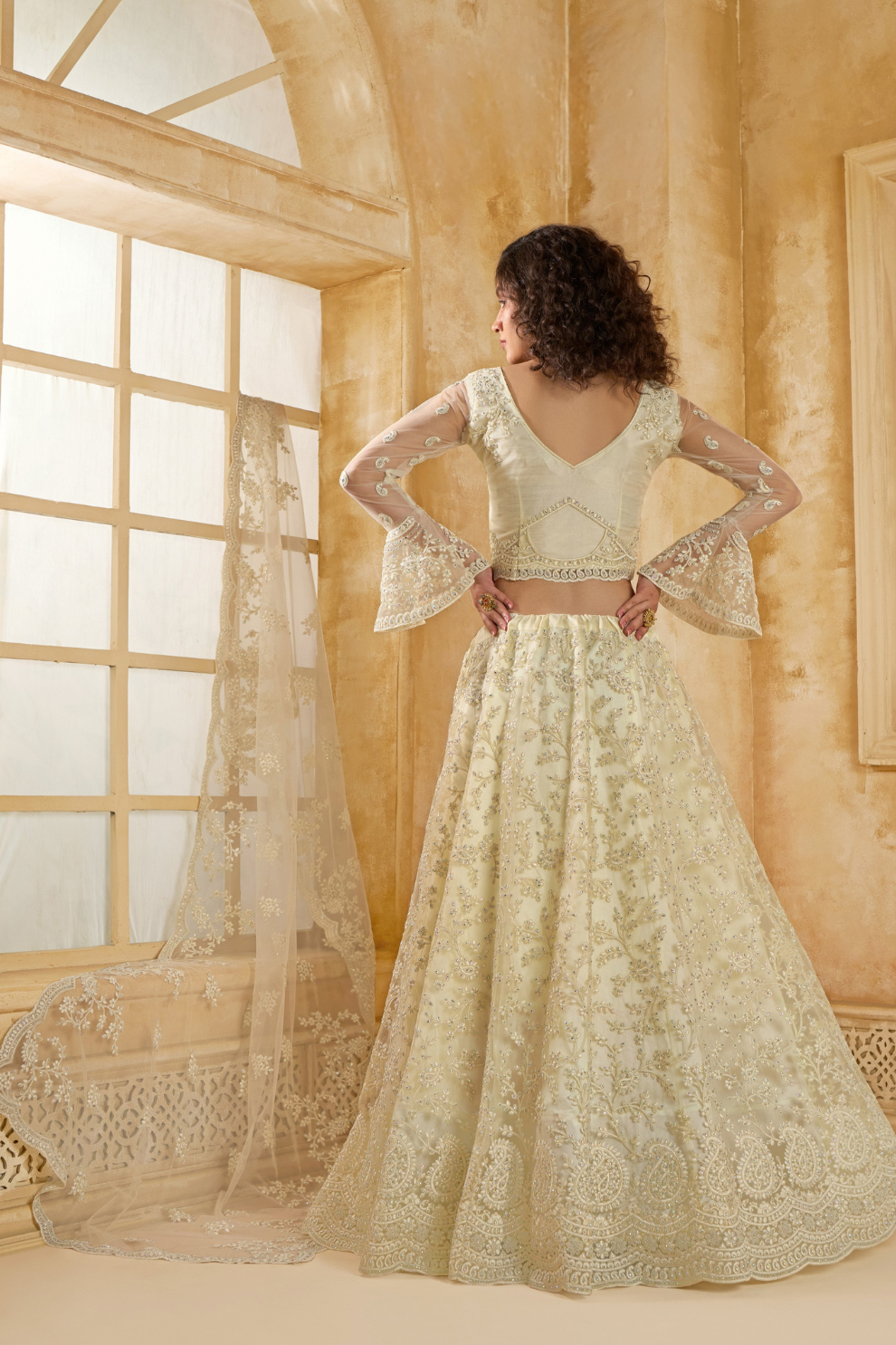 Graceful Cream Net Lehenga Choli For Weddings And Parties