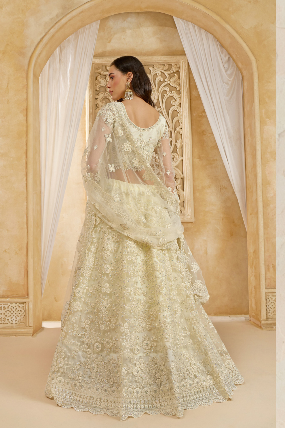 Soft Cream Net Lehenga Choli With Opulent Bridal Embroidery