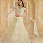 Soft Cream Net Lehenga Choli With Opulent Bridal Embroidery